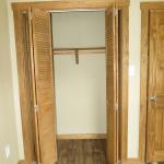 Honeysuckle Closet with Hickory Bifold Doors at Recreational Resort Cottages and Cabins
