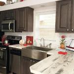 Beautiful Kitchen with Stainless Steel Farm Sink at Recreational Resort Cottages and Cabins in Rockwall, Texas